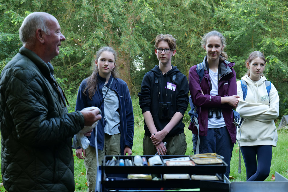 Bird ringing demonstration at BTO Bird Camp England 2023 by Alicia Hayden.