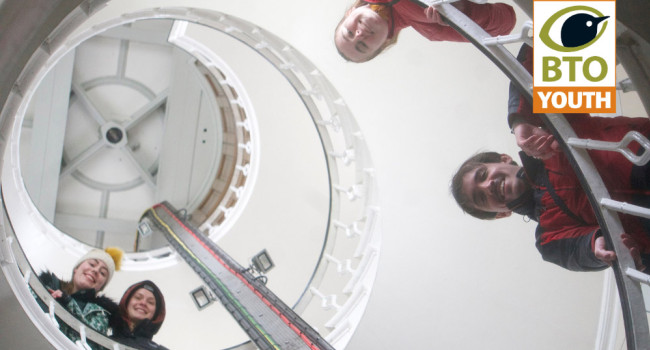 Participants on the Isle of May trip stand in the staircase of the Observatory. Heather Fortune